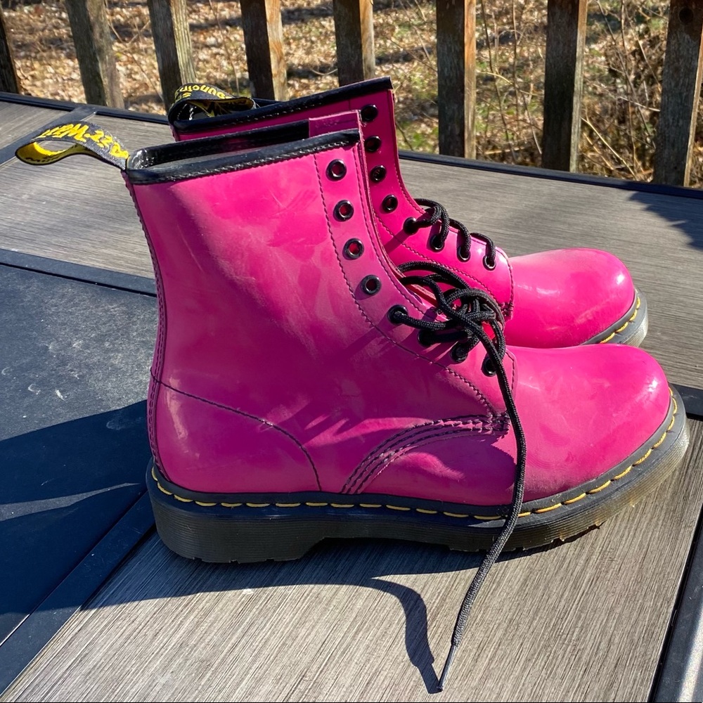 Size 9 Dr.Martens pink, shiny, lace up boots. Like new. May never have been worn